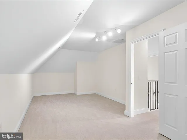 a front view of a house with a garden and yard