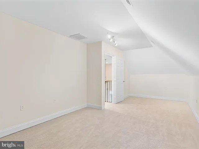 a view of a house with white walls