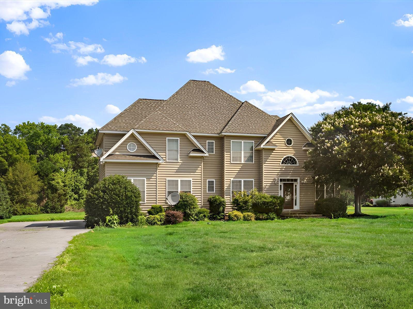 3236 Noble Farm Road Eden, MD 21822 - Photo 55 of 57 a front view of a house with a yard and potted plants