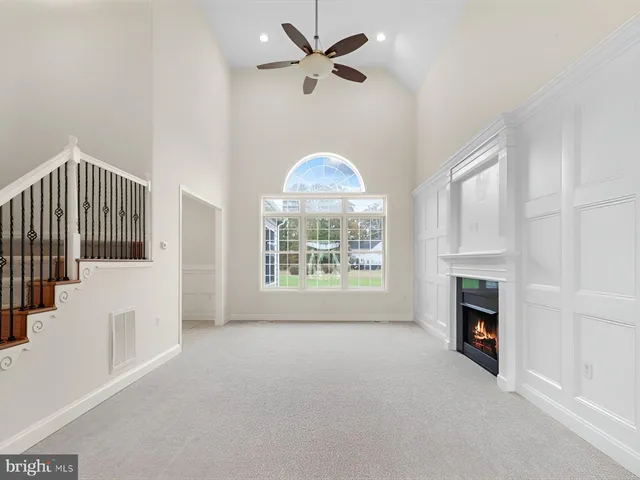 a view of an empty room and fire place