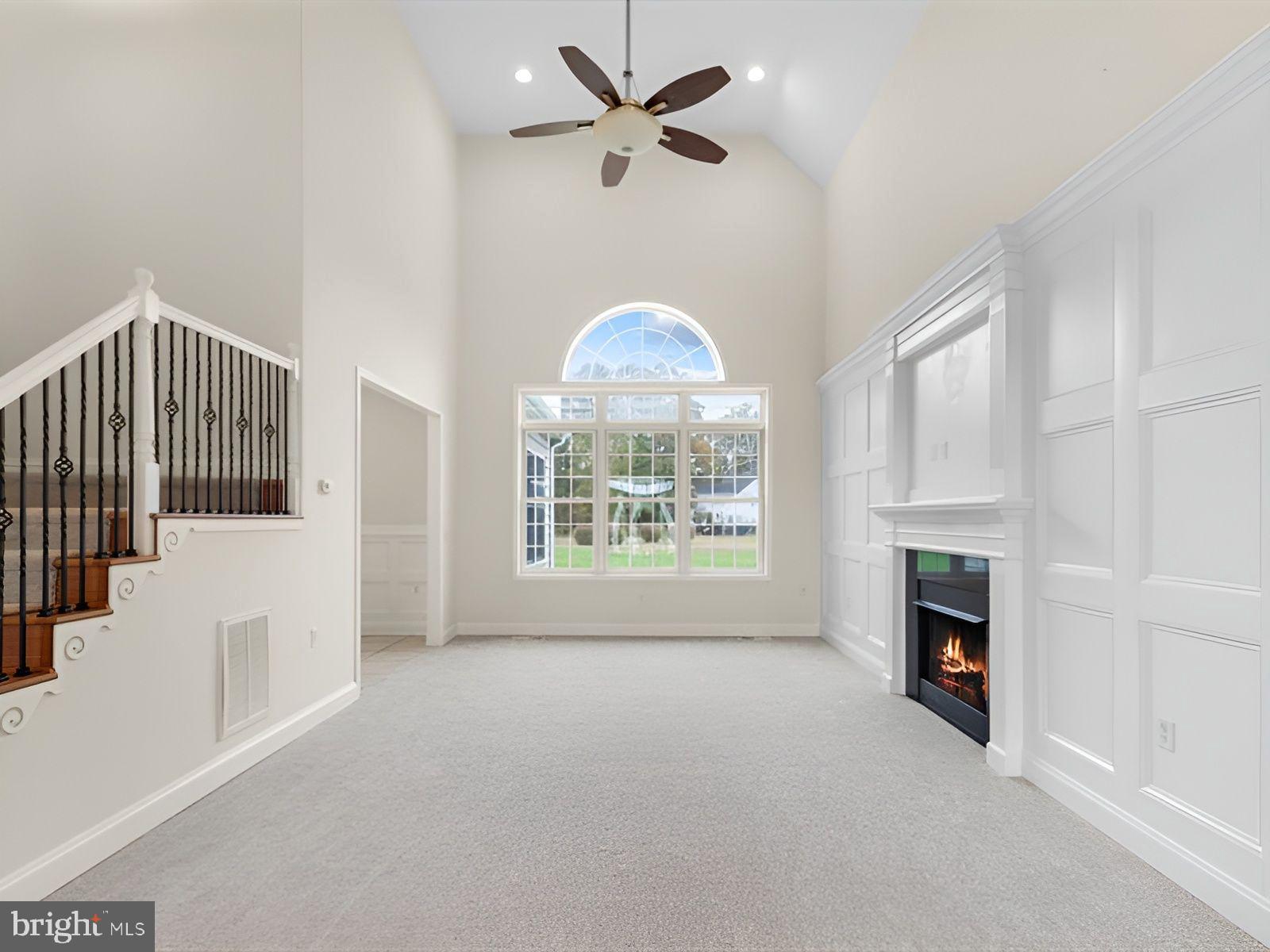 3236 Noble Farm Road Eden, MD 21822 - Photo 10 of 57 an empty room with fireplace fan and windows
