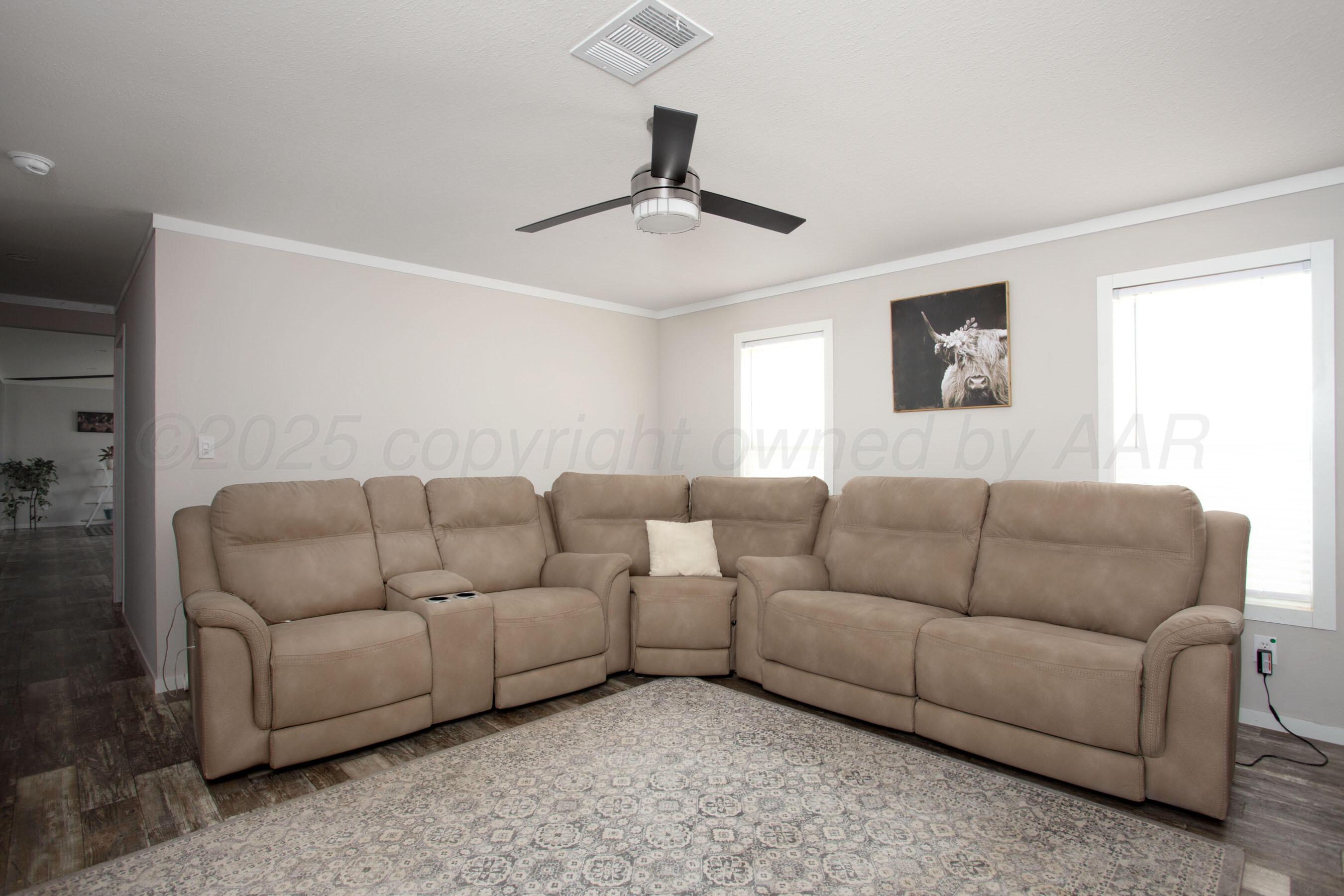 6300 Voorhees Road Amarillo, TX 79119 - Photo 12 of 27 a living room with furniture and a window