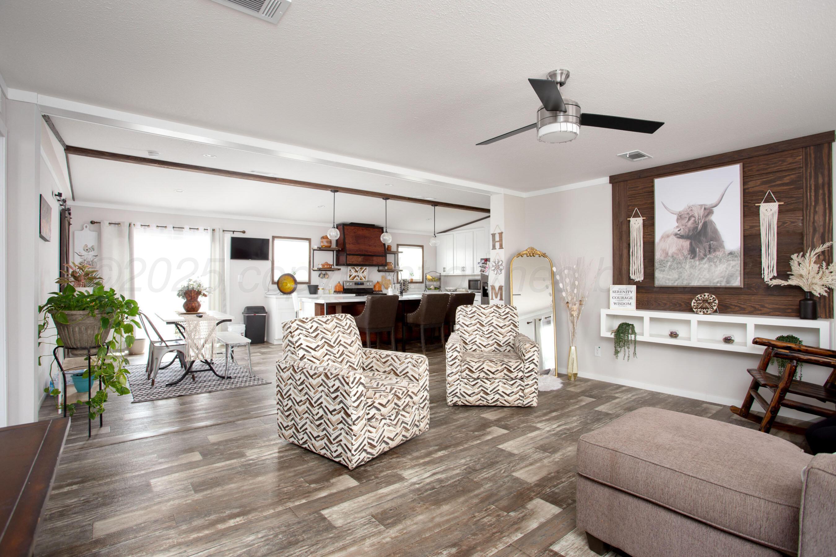 6300 Voorhees Road Amarillo, TX 79119 - Photo 2 of 27 a living room with furniture and wooden floor