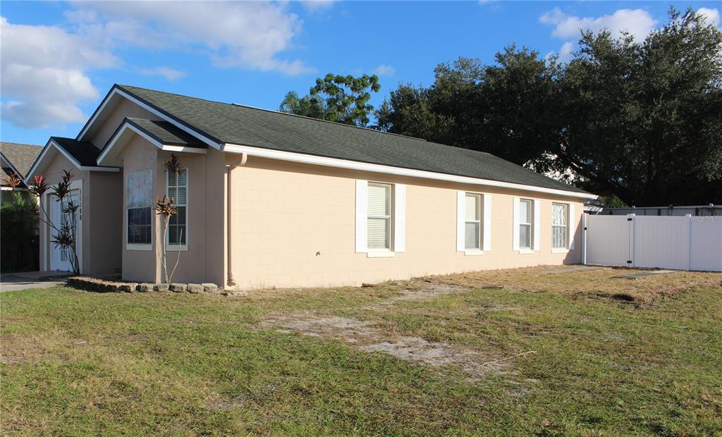11100 Einbender Road Orlando, FL 32825 - Photo 4 of 26 a house with trees in the background
