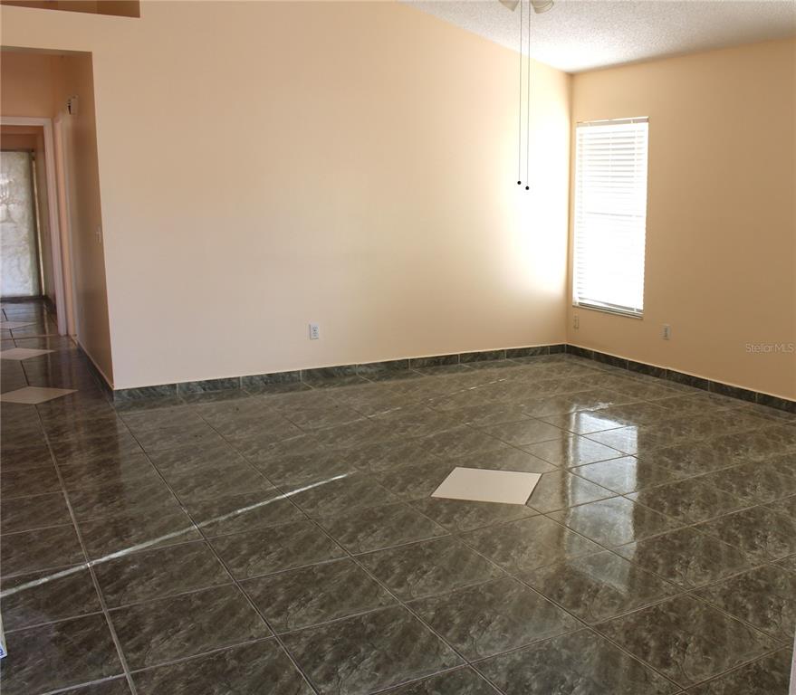 11100 Einbender Road Orlando, FL 32825 - Photo 9 of 26 an empty room with windows