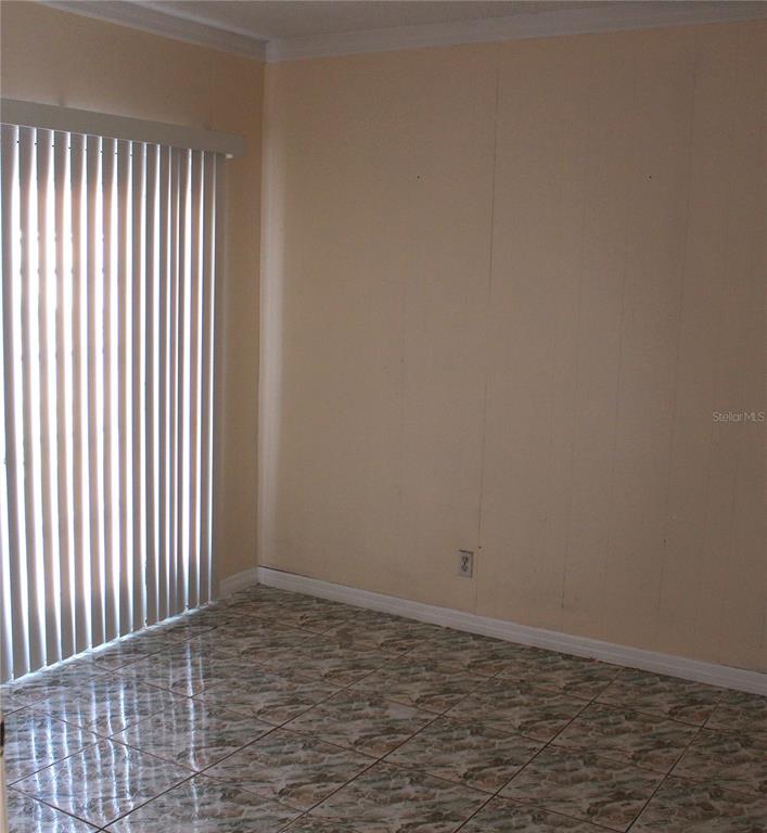 11100 Einbender Road Orlando, FL 32825 - Photo 10 of 26 an empty room with wooden floor