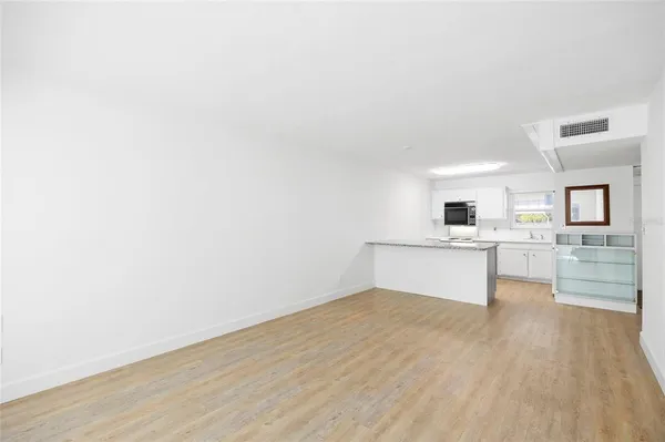a view of kitchen with wooden floor