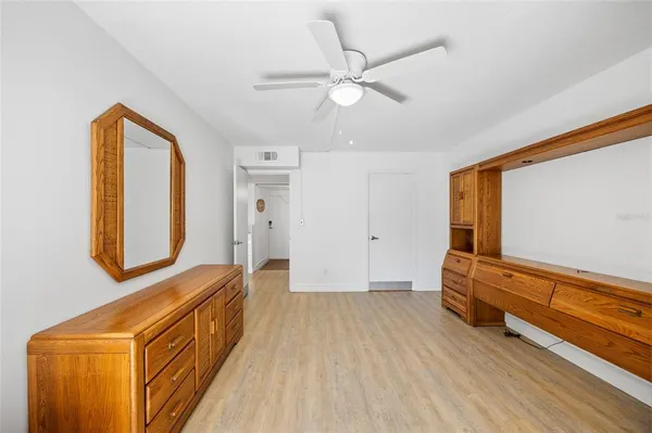 a view of room with wooden floor