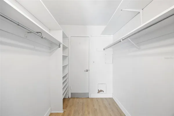 a bathroom with a sink a toilet a mirror and shower