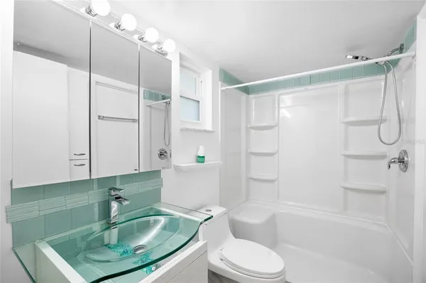 a view of a hallway with washer and dryer