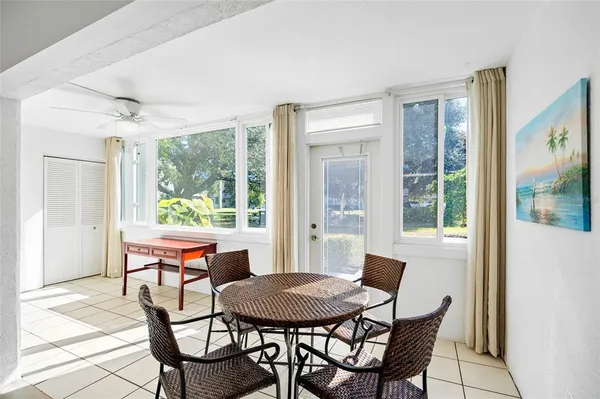 a dining room with furniture and wooden floor