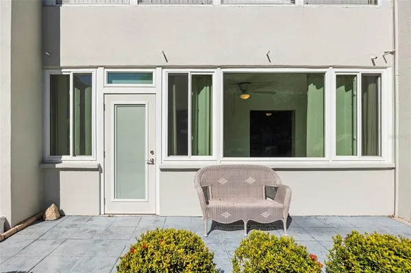 a front view of a house with outdoor seating