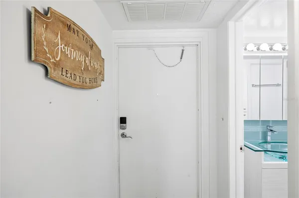 a view of a small space with wooden floor and a window