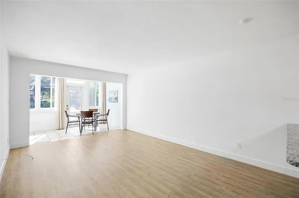 a view of a kitchen with wooden floor