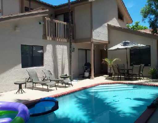 7516 West Sierra Drive Boca Raton, FL 33433 - Photo 2 of 3 a view of a house with swimming pool