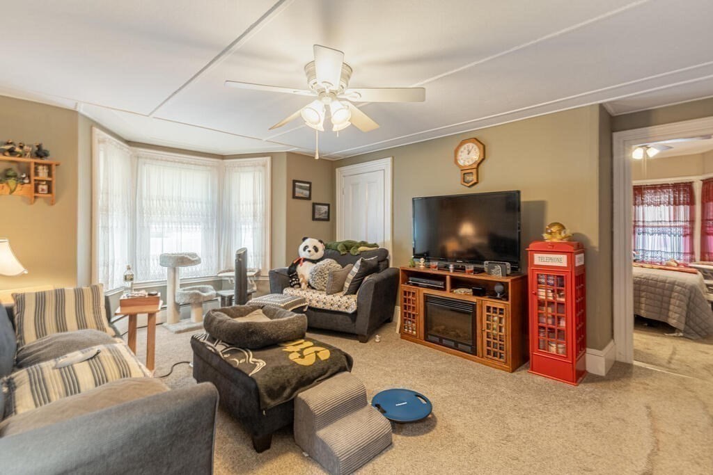 20 Washington Street Danvers, MA 01923 - Photo 13 of 39 a living room with furniture and a flat screen tv