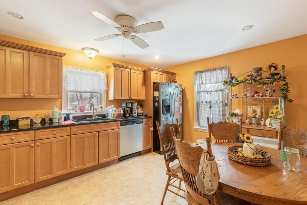 20 Washington Street Danvers, MA 01923 - Photo 20 of 39 a kitchen with stainless steel appliances granite countertop a sink and cabinets