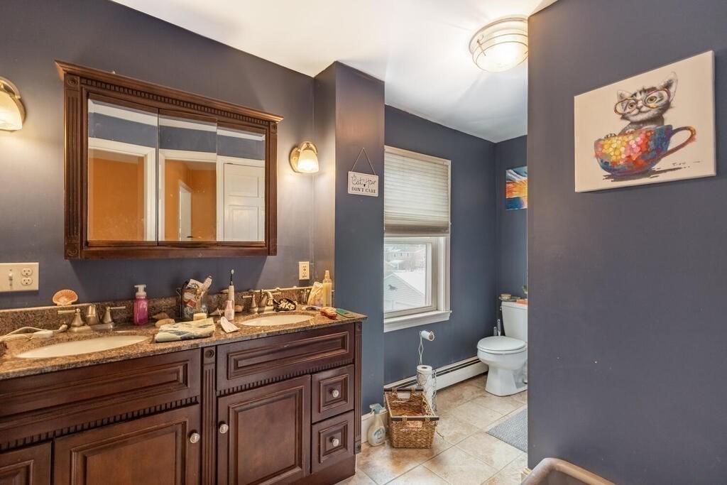 20 Washington Street Danvers, MA 01923 - Photo 26 of 39 a bathroom with a granite countertop sink mirror and toilet