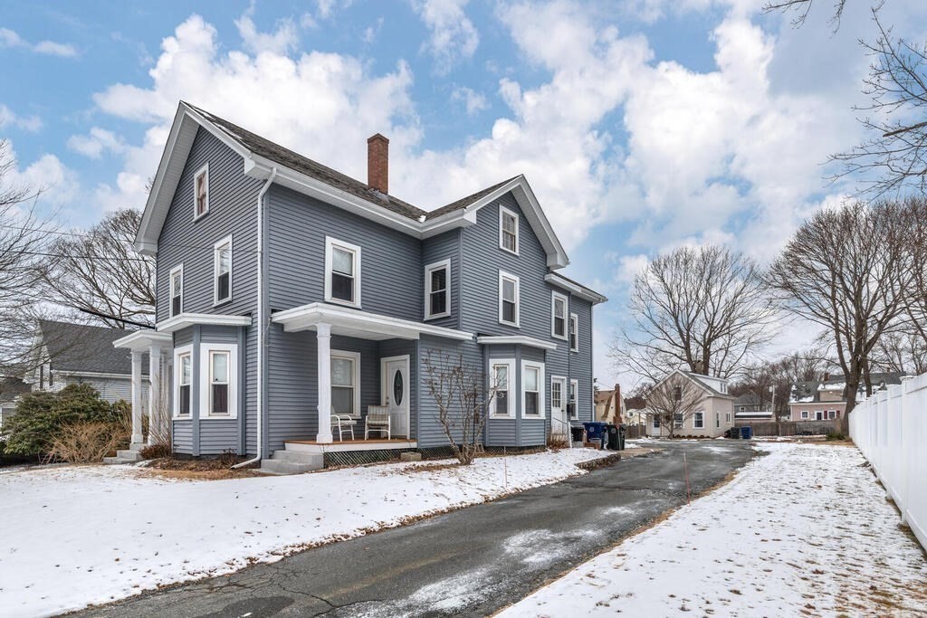 20 Washington Street Danvers, MA 01923 - Photo 3 of 39 a front view of a house with a yard