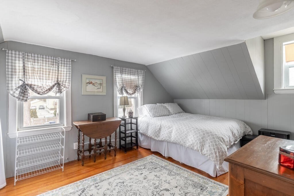 20 Washington Street Danvers, MA 01923 - Photo 34 of 39 a bedroom with a bed and a window