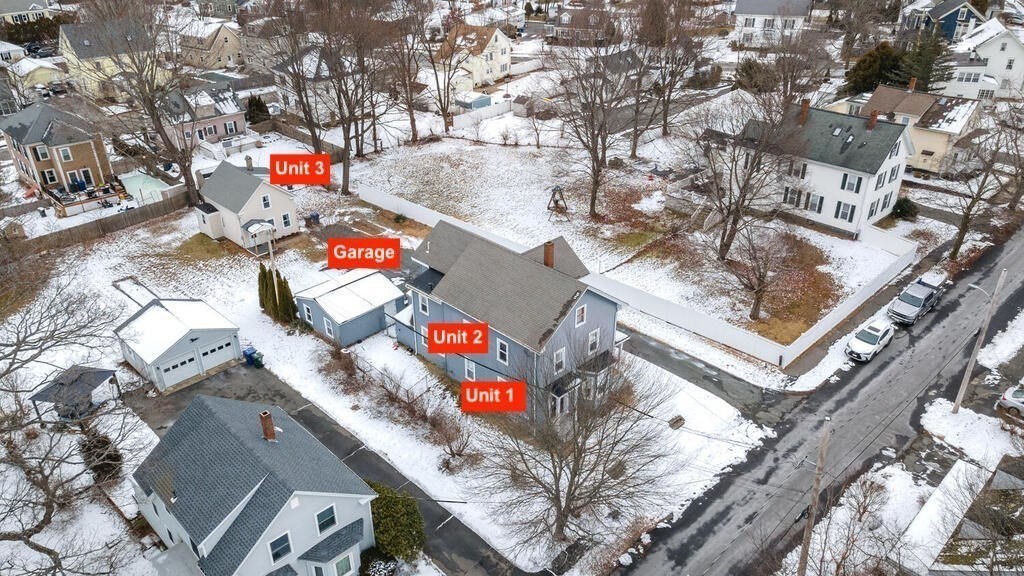 20 Washington Street Danvers, MA 01923 - Photo 7 of 39 an aerial view of multi story residential apartment building with retail shops