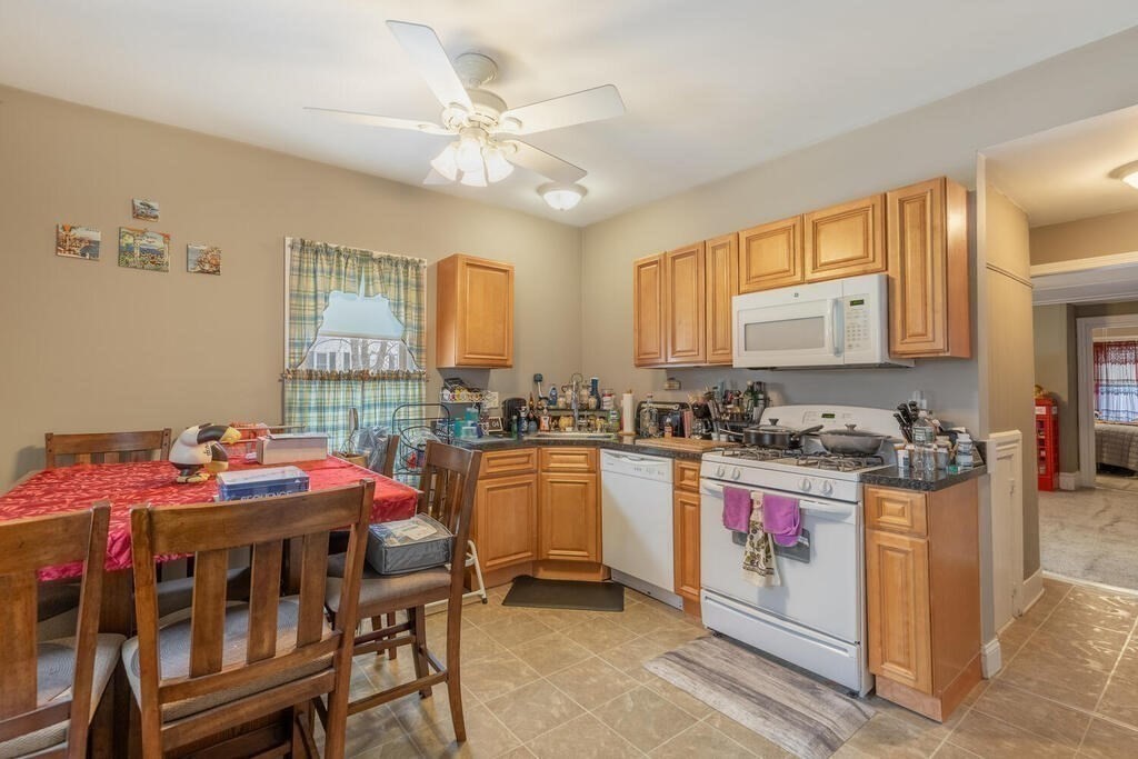 20 Washington Street Danvers, MA 01923 - Photo 9 of 39 a kitchen with a sink stove and cabinets