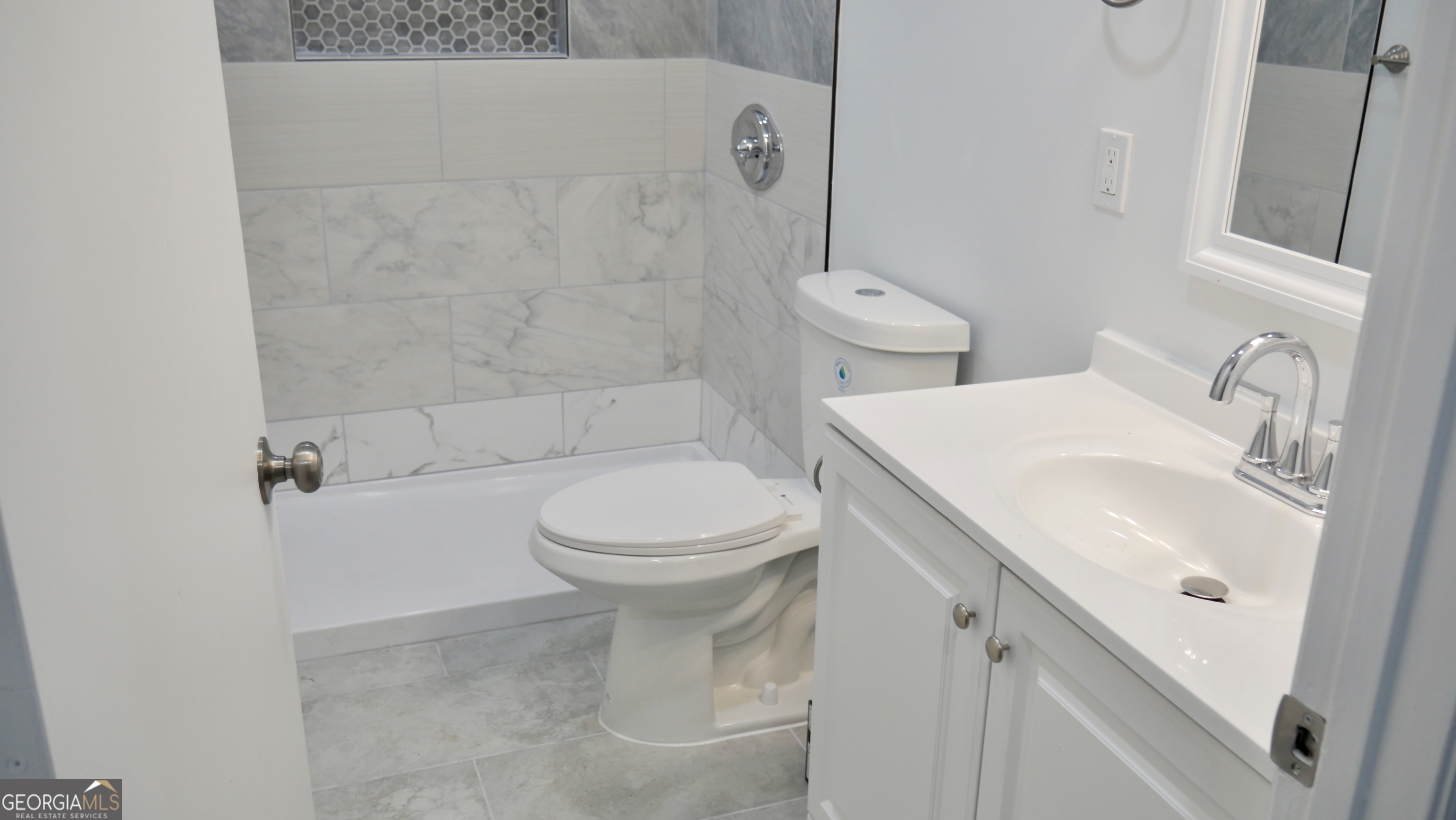 2830 North Lumpkin Road Columbus, GA 31903 - Photo 5 of 12 a bathroom with a sink toilet and shower