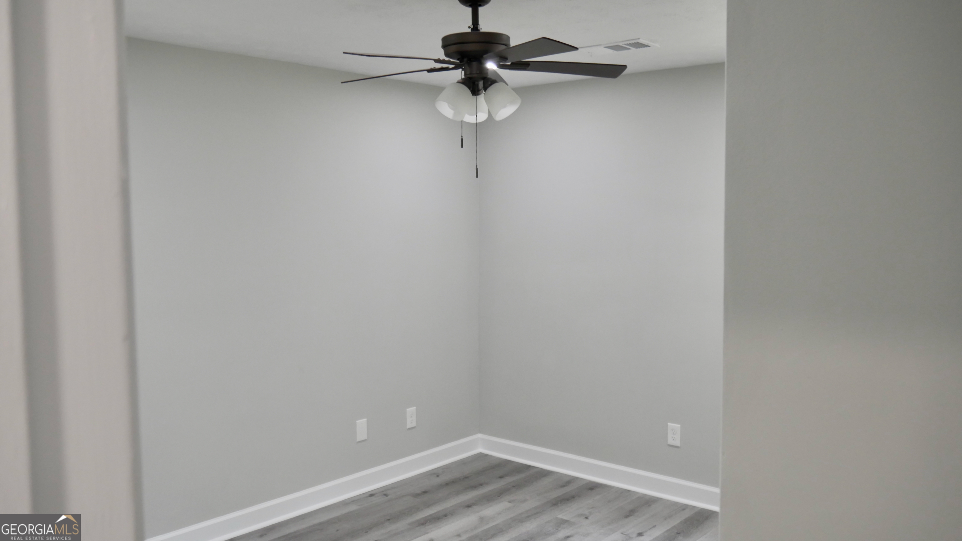 2830 North Lumpkin Road Columbus, GA 31903 - Photo 10 of 12 a view of a room with a fan and wooden floor