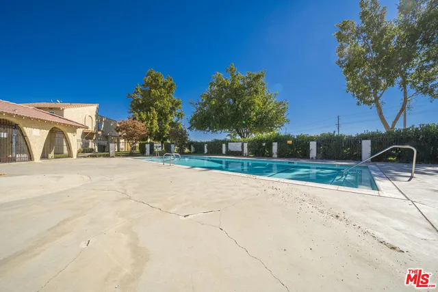 a view of swimming pool with a yard
