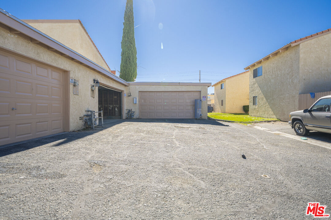 43609 Stanridge Avenue Lancaster, CA 93535 - Photo 20 of 25 a view of a house with a backyard