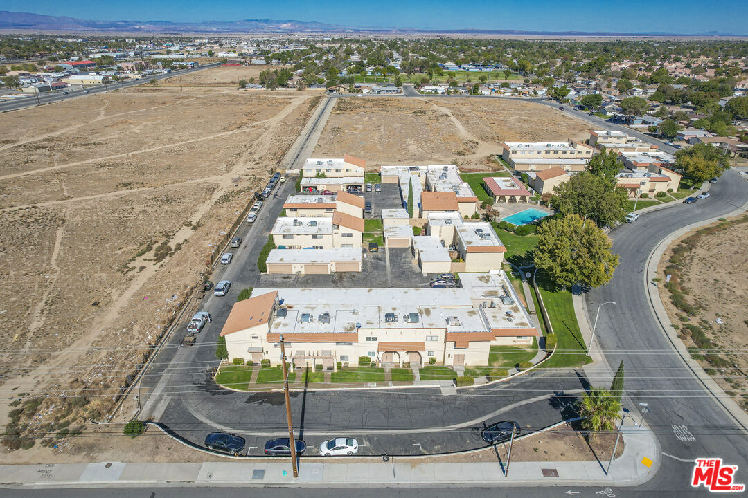 43609 Stanridge Avenue Lancaster, CA 93535 - Photo 23 of 25 a view of a swimming pool with a yard