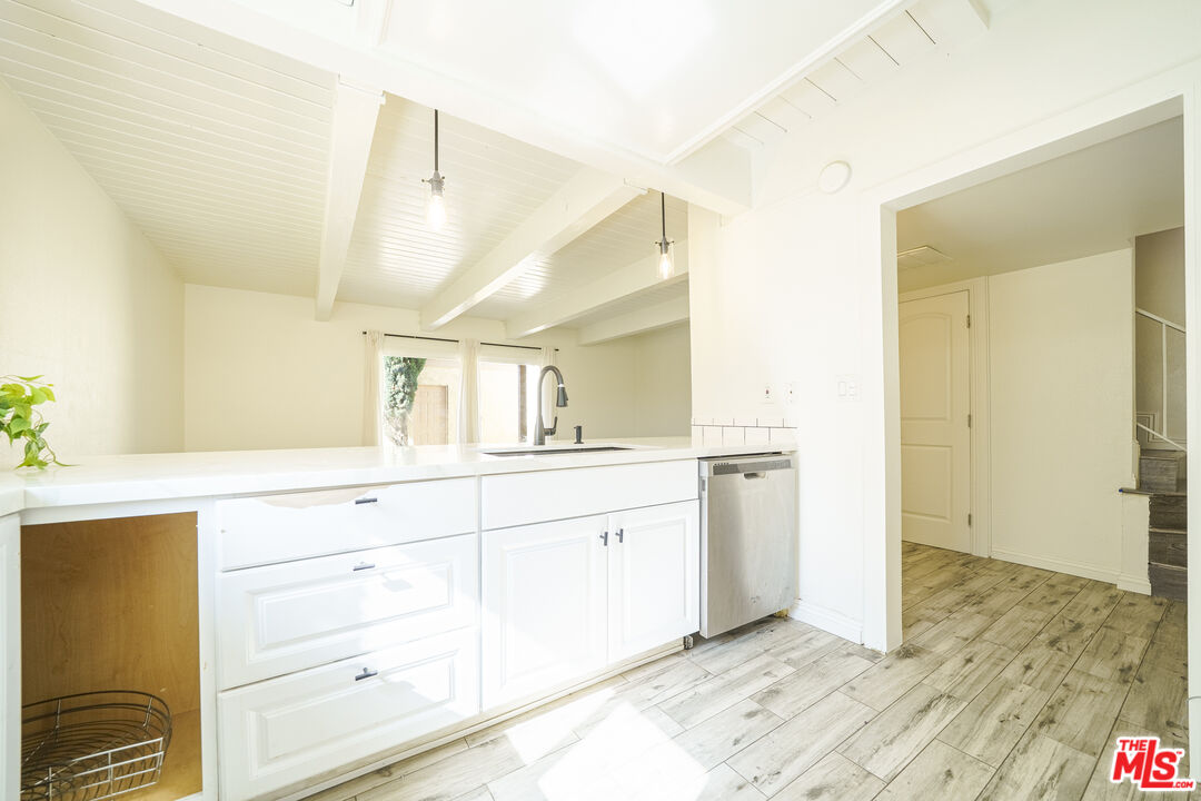 43609 Stanridge Avenue Lancaster, CA 93535 - Photo 7 of 25 a bathroom with a sink and a mirror