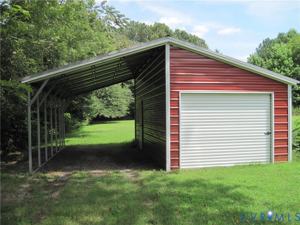 94 Sand Hill Road Toano, VA 23168 - Photo 18 of 20 Detached 25x12 metal carport and 25x12 garage/util