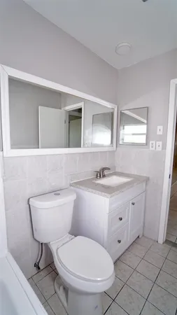 a utility room with two washing machine