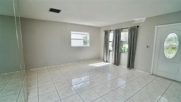 a view of an empty room with a window