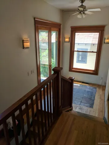 a view of a hallway with a window
