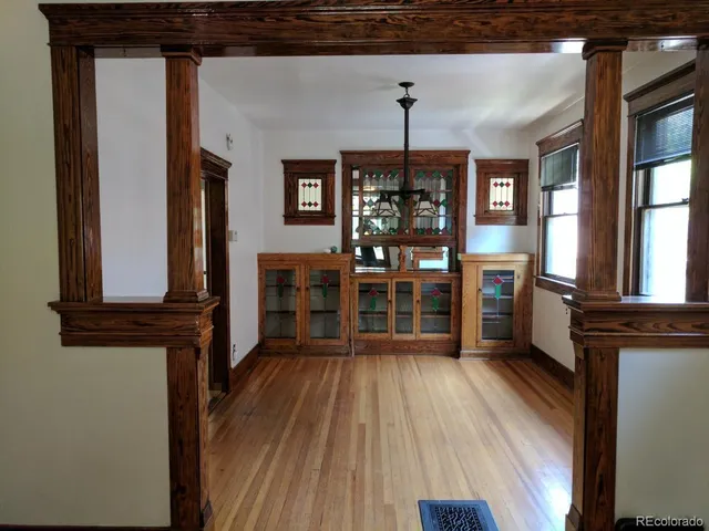 a view of a entryway with furniture and wooden floor