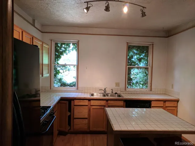 a view of a dining room with furniture and window