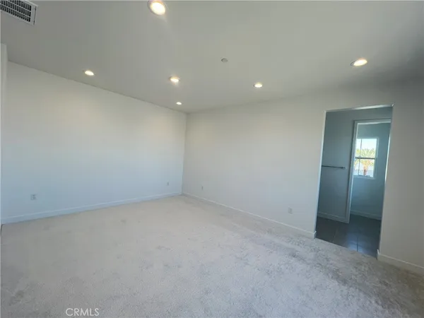 an empty room with a bathroom