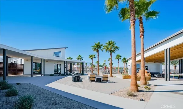 a very nice looking room with a large window and palm trees