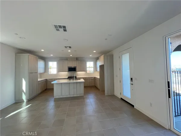 a kitchen with a sink stainless steel appliances and cabinets