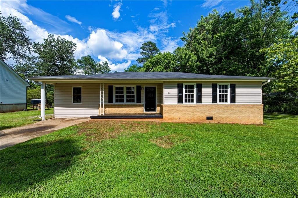 300 Cash Town Road Aragon, GA 30104 - Photo 3 of 28 a front view of a house with a yard