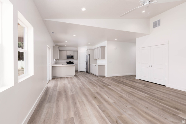 51 West 500 South Monroe, UT 84754 - Photo 16 of 41 Open-concept living space with wood-finish flooring, vaulted ceilings, and recessed lighting