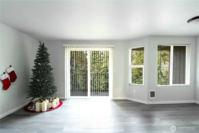 a view of an empty room with a window and toys