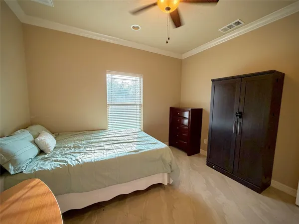 a bedroom with a bed and a closet