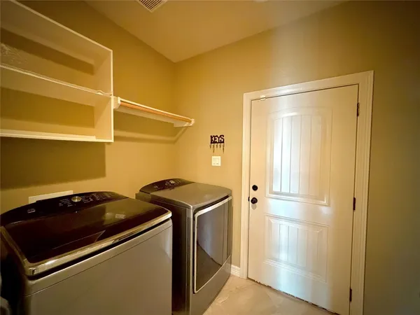 a utility room with washer and dryer