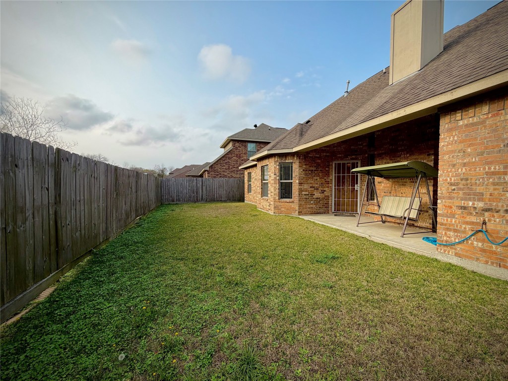 3741 Debbie Lane Groves, TX 77619 - Photo 16 of 16 a view of a house with backyard and garden