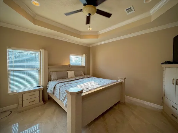 a bedroom with a bed and window