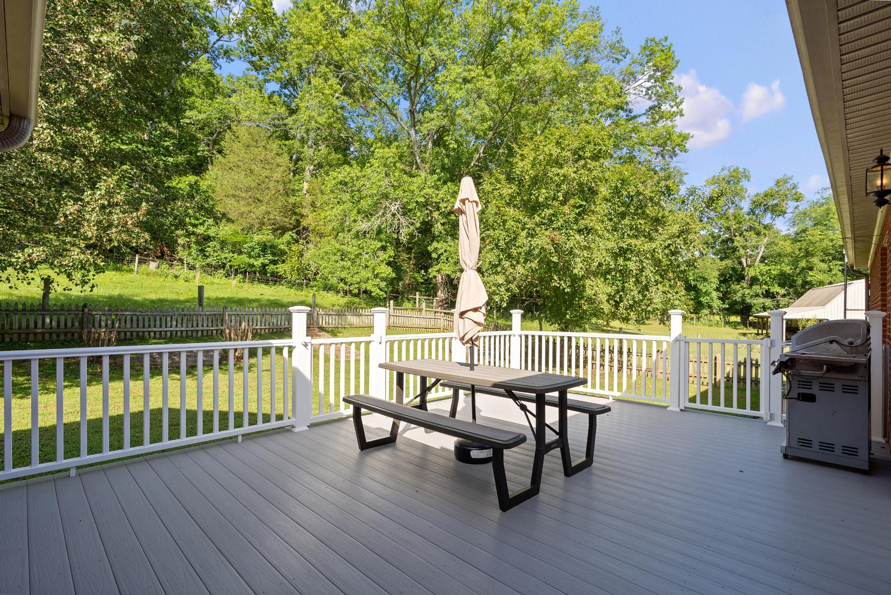 28 Spring Valley Road Taft, TN 38488 - Photo 36 of 55 a view of a deck with two chair and wooden fence