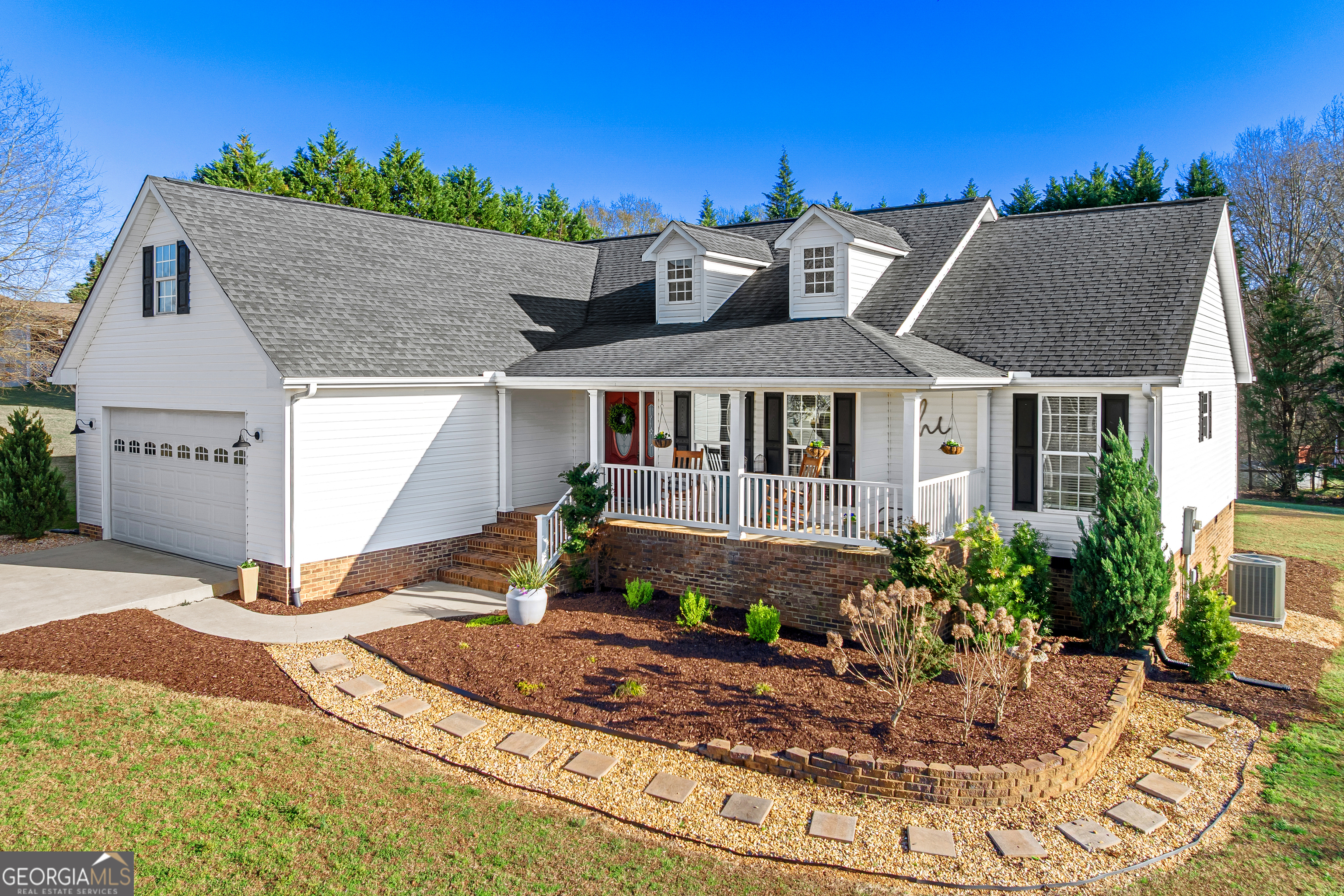 175 Highland Ridge Drive Hartwell, GA 30643 - Photo 1 of 46 a front view of a house with garden